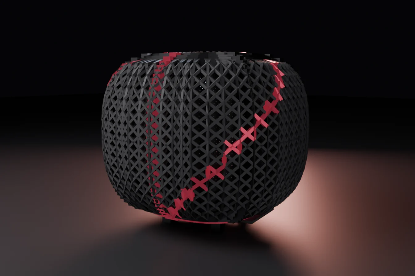 The Garnet machine closed: a rounded cage of fine dark struts woven in a diamond lattice, standing just clear of the floor on low feet, with a deep red line of garnet members running diagonally across its face and a warm pool of light on the floor behind it.